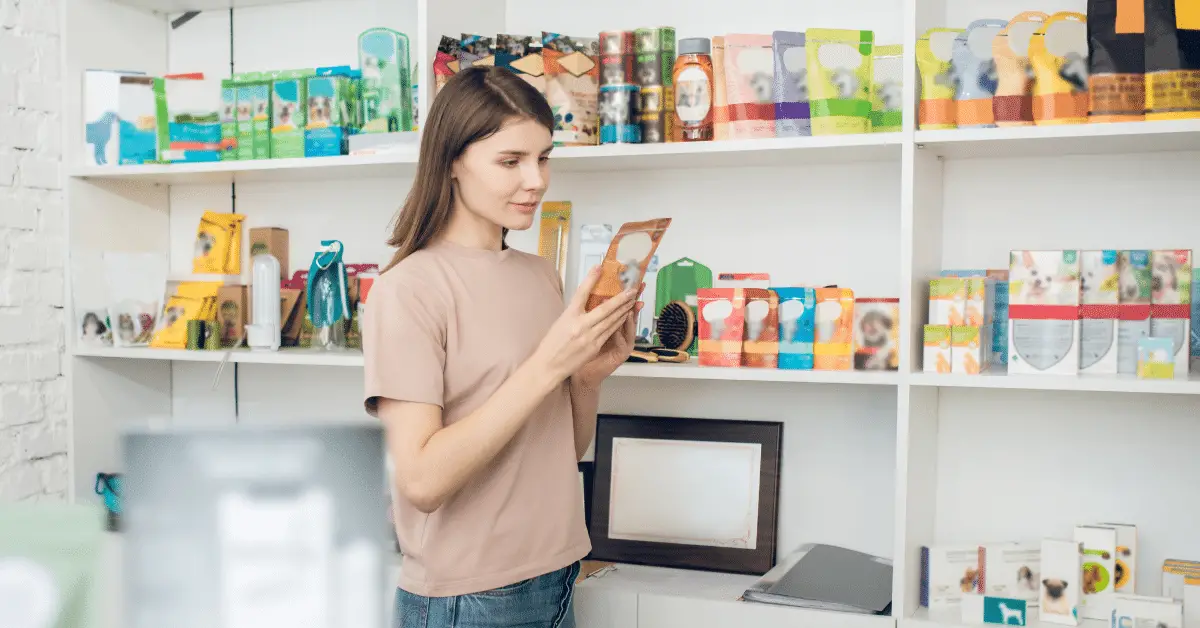 Is Polysorbate 80 Toxic to Dogs? a woman reading the label of a pet product