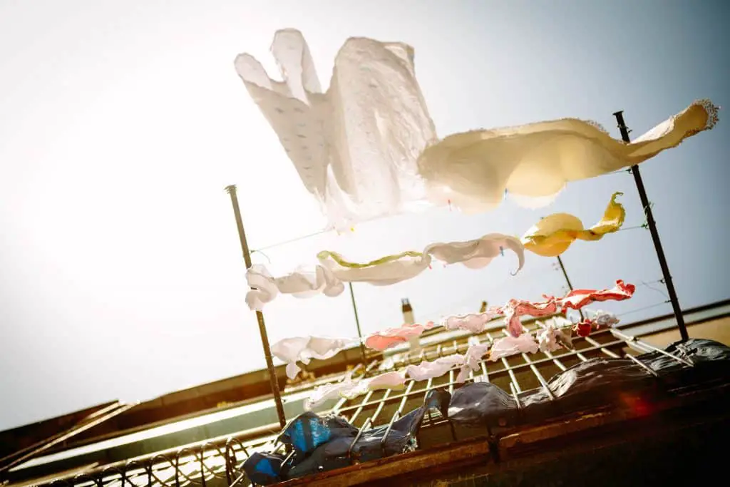 Clothes drying on a clothesline in the wind.