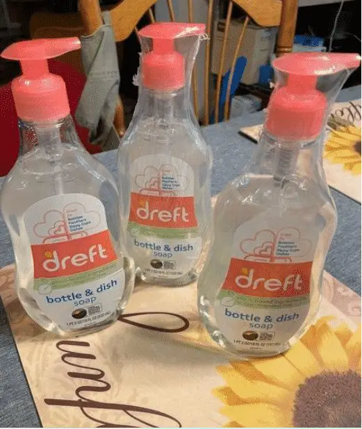 Three Dreft bottle and dish soap on a table