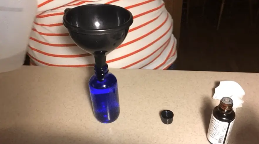 filling spray bottle with essential oil