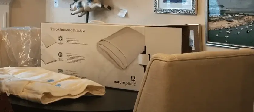 Pillow on a table next to a chair