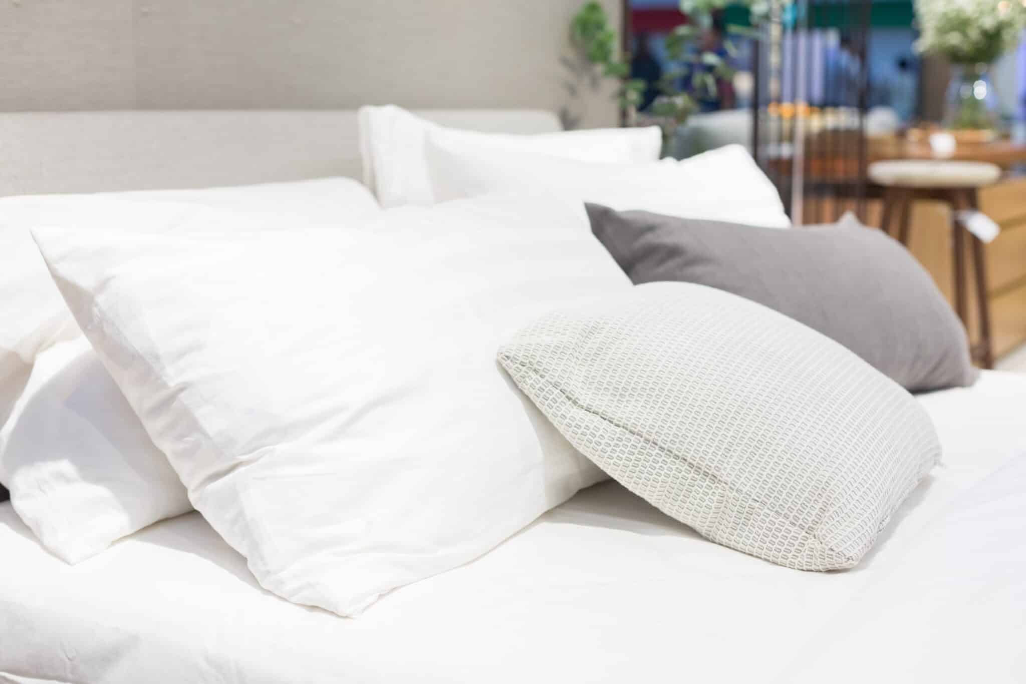 Bed with white sheets and pillows