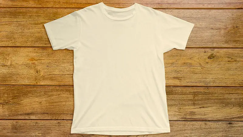 White t-shirt on a wooden table