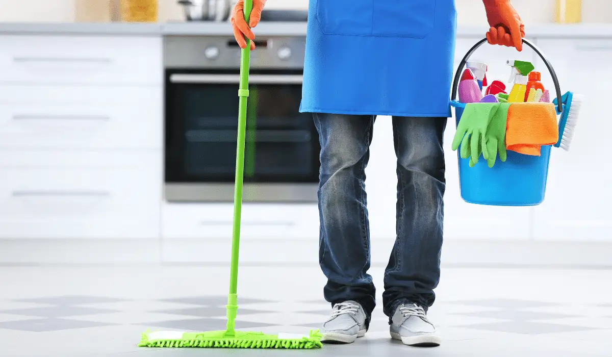 Person with carrying cleaning kit