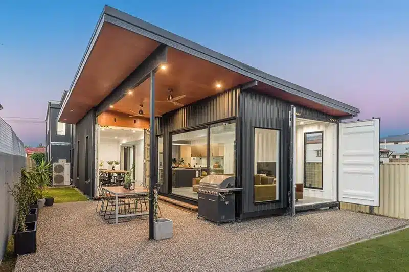 Container house with a patio and grill