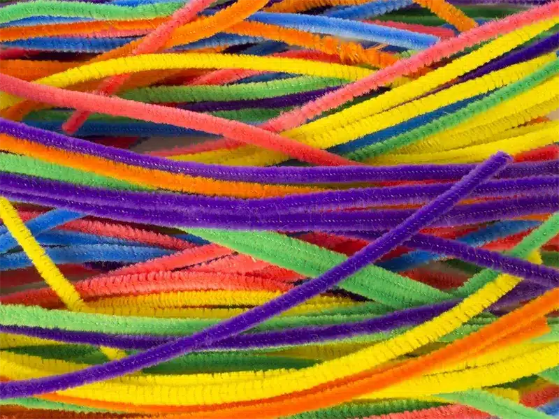 Colorful pipe cleaners on white background
