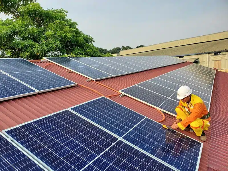 Person installing solar panel