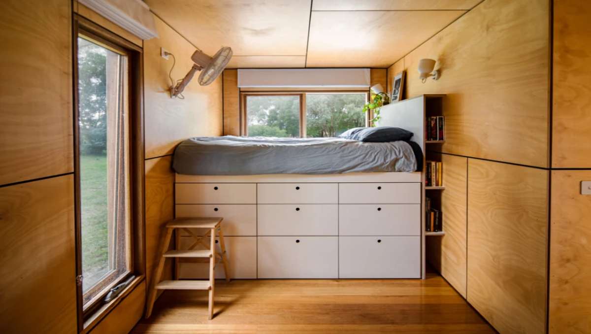 Creative storage solutions inside a shipping container home.
