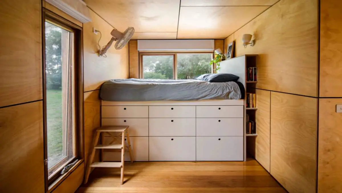 Creative storage solutions inside a shipping container home.