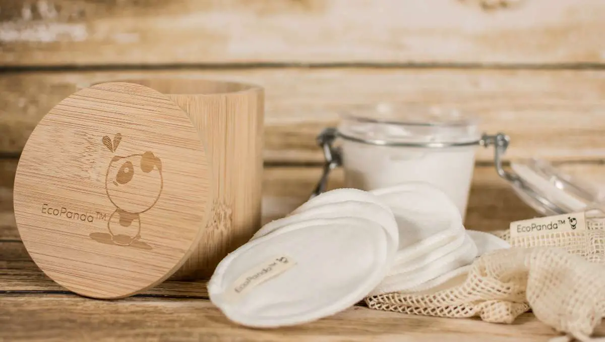 Sustainable and eco-friendly bamboo jar and cotton pads labeled EcoPanda.