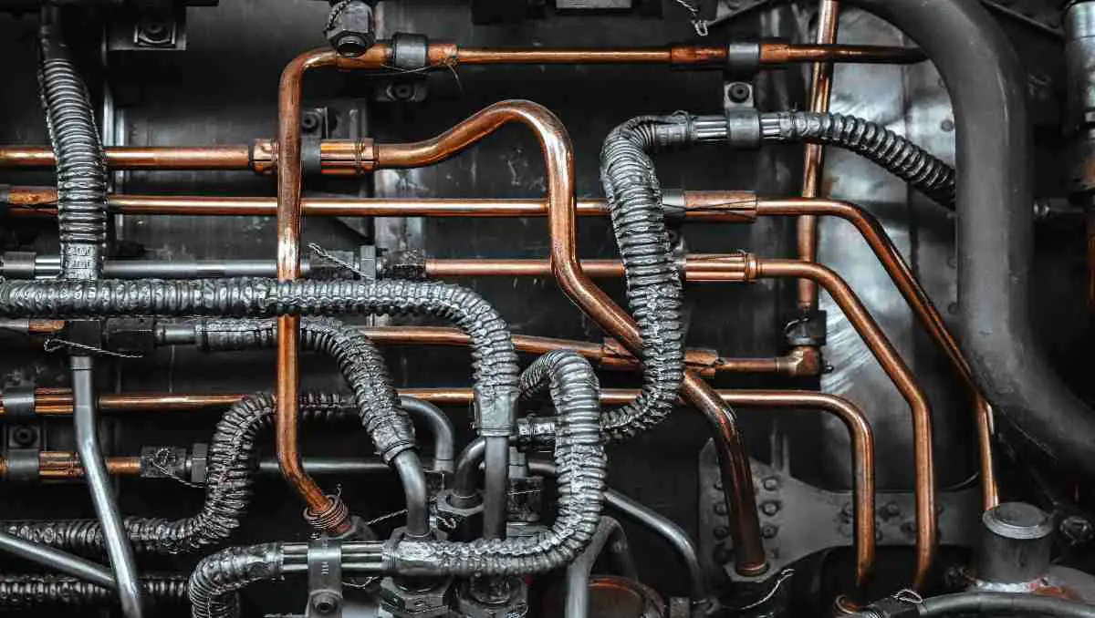 Metal pipes and valves in a traditional house plumbing system.