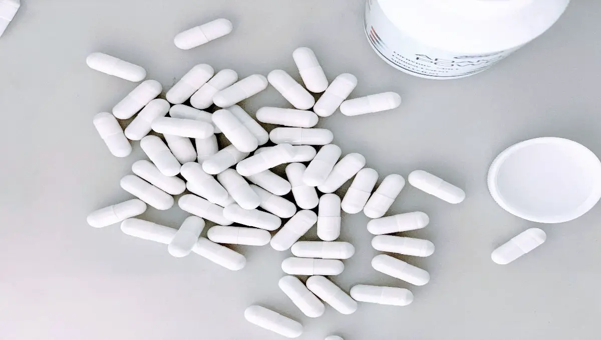 White capsules on the counter. 