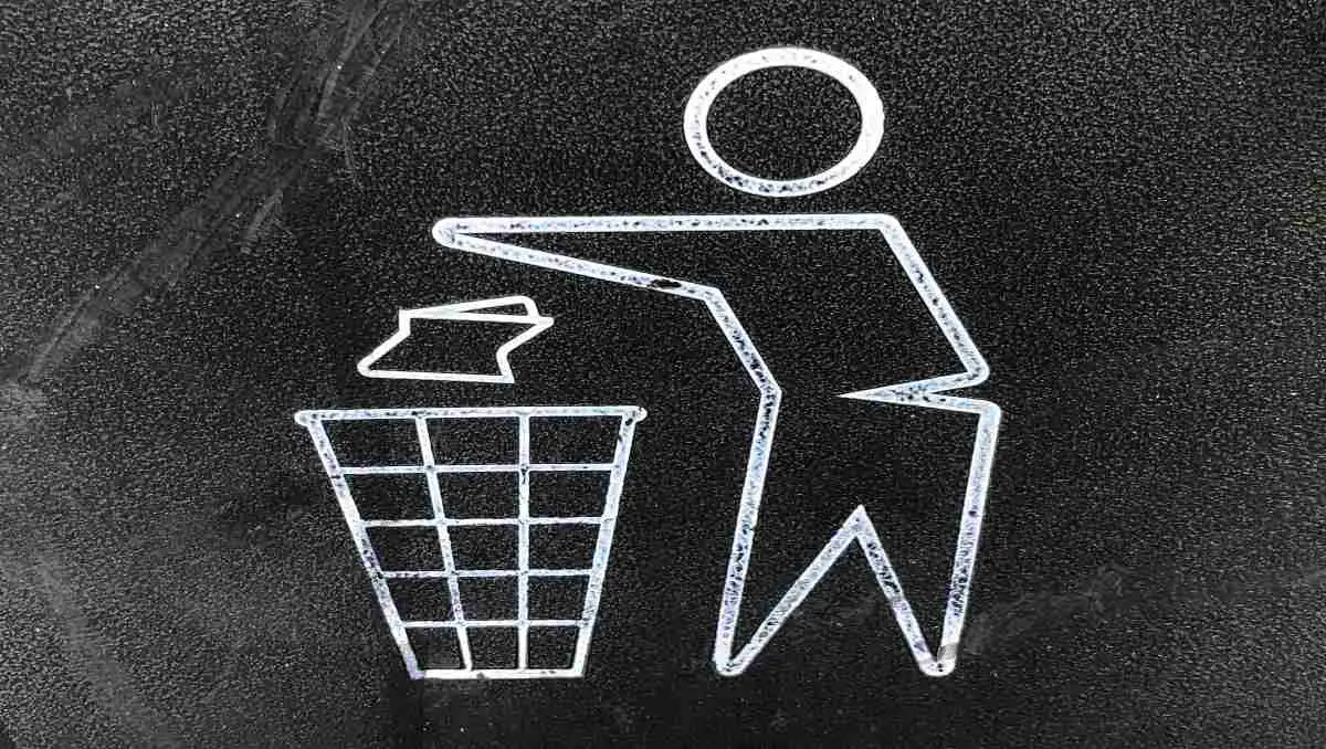 An abstract of a man throwing waste in the bin as logo for recycling.