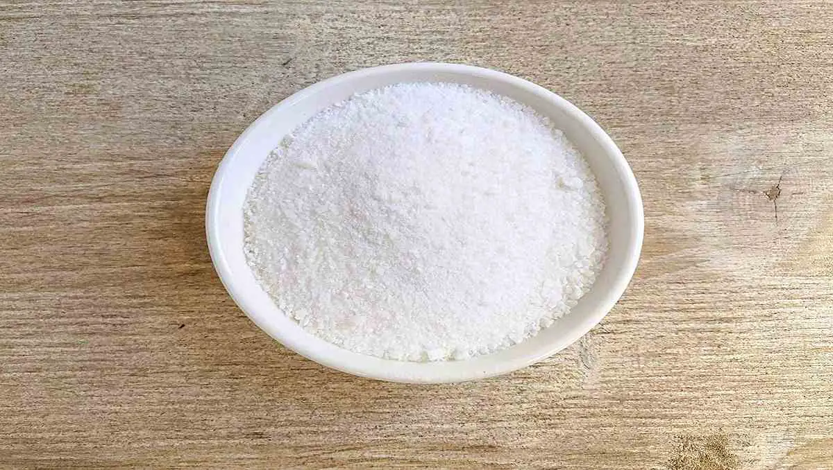 A bowl of finely ground alum powder.