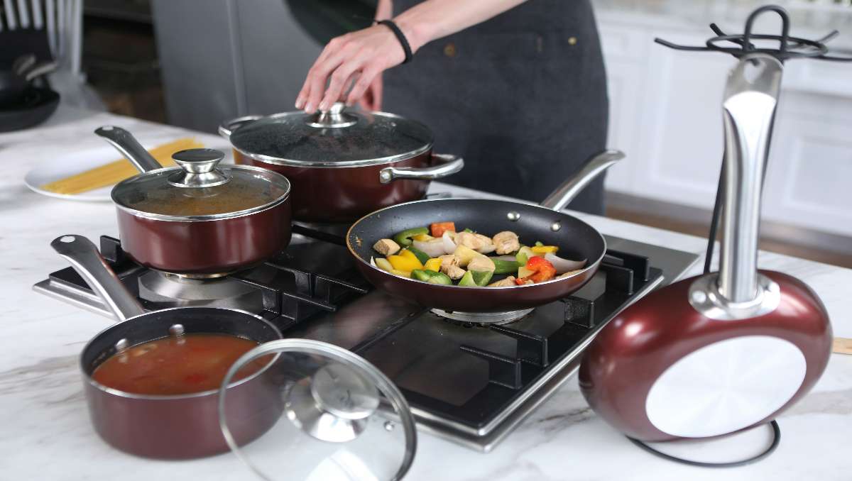 A person cooking in the kitchen while using Teflon cookwares.